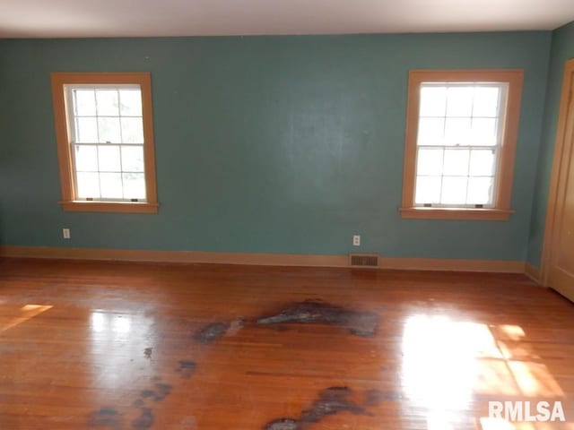 635 S Seigel St, Decatur, IL 62522 - spare room featuring plenty of natural light and wood finished floors