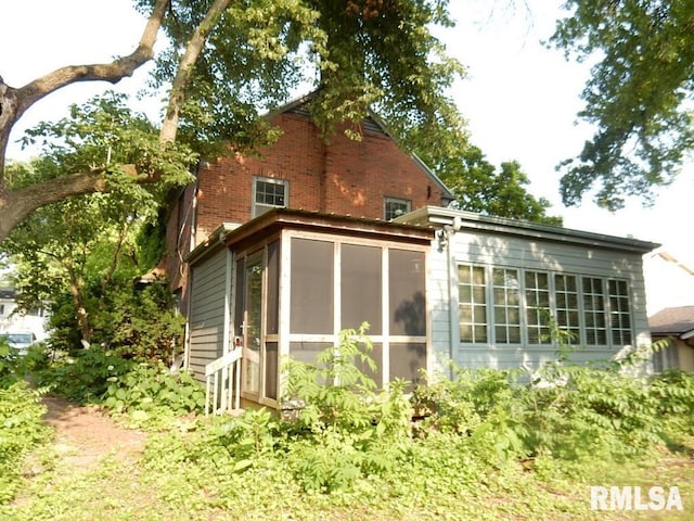 635 S Seigel St, Decatur, IL 62522 - back of house with a sunroom and brick siding