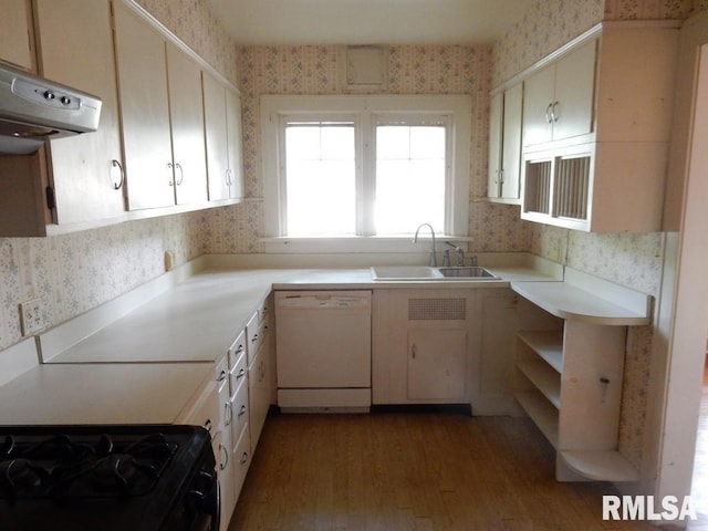 635 S Seigel St, Decatur, IL 62522 - kitchen featuring white dishwasher, wallpapered walls, exhaust hood, light wood finished floors, and light countertops