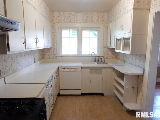 635 S Seigel St, Decatur, IL 62522 - kitchen with white dishwasher, wallpapered walls, range hood, light wood-style floors, and light countertops