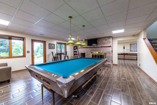 3939 Musholt Strasse Ln, Quincy, IL 62305 - recreation room featuring billiards table, wood tiled floors, a drop ceiling, and a fireplace
