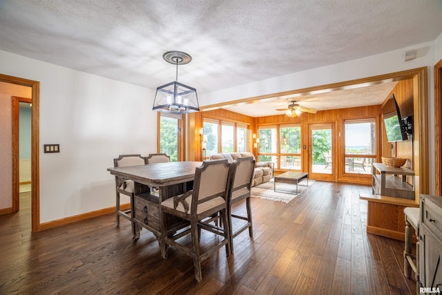 3939 Musholt Strasse Ln, Quincy, IL 62305 - dining room featuring dark wood finished floors, a textured ceiling, and a chandelier