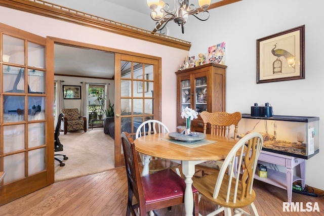 3713 Tyler Ct, Springfield, IL 62711 - dining area with a chandelier, ornamental molding, wood-type flooring, and french doors