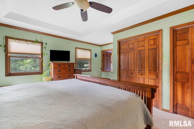 3713 Tyler Ct, Springfield, IL 62711 - carpeted bedroom featuring multiple windows, crown molding, a closet, a ceiling fan, and a textured ceiling