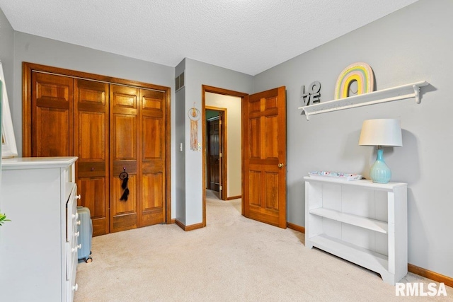 3713 Tyler Ct, Springfield, IL 62711 - bedroom with light carpet, a closet, and a textured ceiling