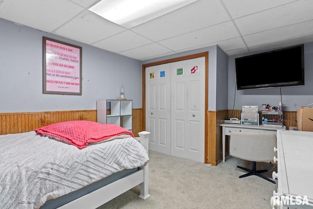 3713 Tyler Ct, Springfield, IL 62711 - bedroom with a paneled ceiling, wainscoting, carpet floors, wood walls, and a closet