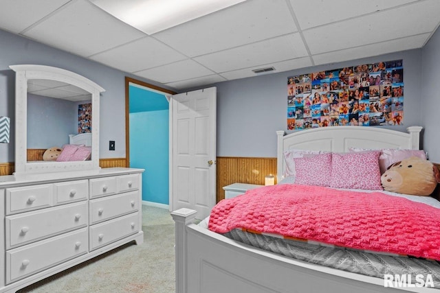 3713 Tyler Ct, Springfield, IL 62711 - bedroom with a paneled ceiling, a wainscoted wall, light carpet, and wooden walls