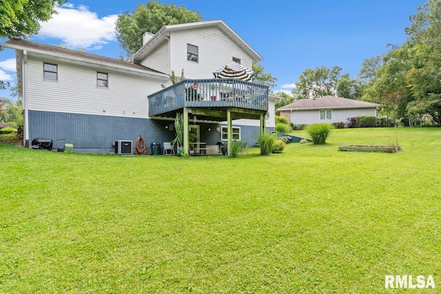 3713 Tyler Ct, Springfield, IL 62711 - rear view of house with a wooden deck, a yard, and a chimney