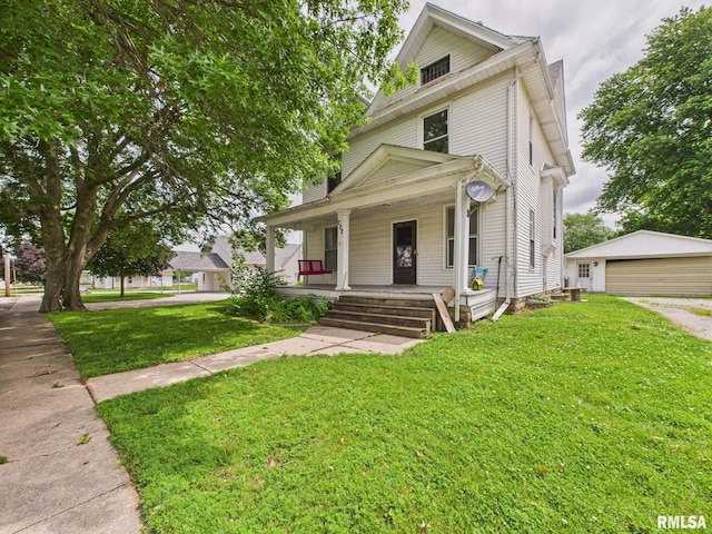 222 N Lewis St, Blue Mound, IL 62513 - traditional style home featuring a porch, an outbuilding, a detached garage, and a front yard