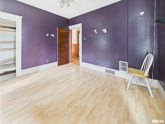 222 N Lewis St, Blue Mound, IL 62513 - unfurnished room with wood finished floors and ceiling fan
