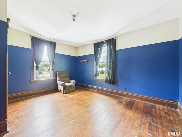 222 N Lewis St, Blue Mound, IL 62513 - unfurnished room featuring hardwood / wood-style flooring and baseboards