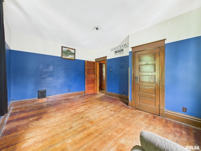 222 N Lewis St, Blue Mound, IL 62513 - unfurnished room with baseboards and wood finished floors
