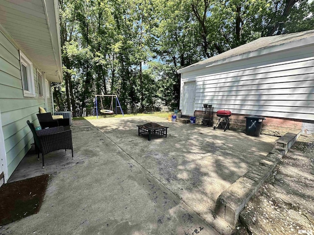 1025 S 15th St, Quincy, IL 62301 - view of patio / terrace with a fire pit and view of scattered trees