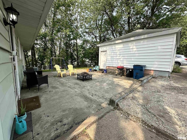1025 S 15th St, Quincy, IL 62301 - view of patio featuring an outdoor fire pit