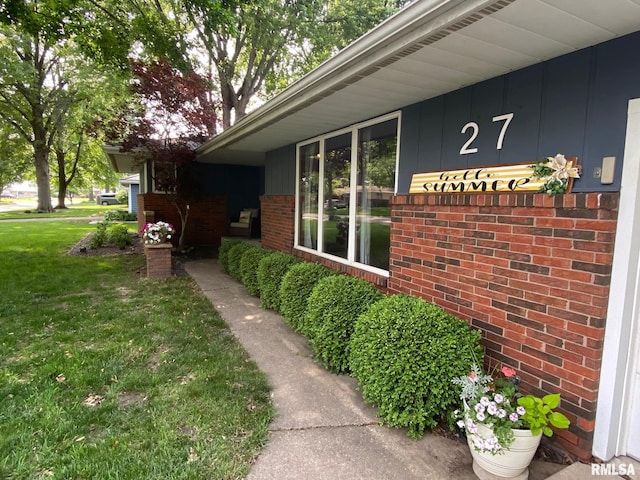 27 Apache Dr, Springfield, IL 62711 - doorway to property with brick siding and a yard
