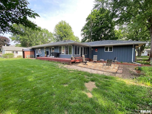 27 Apache Dr, Springfield, IL 62711 - back of property featuring a patio, a sunroom, and a wooden deck