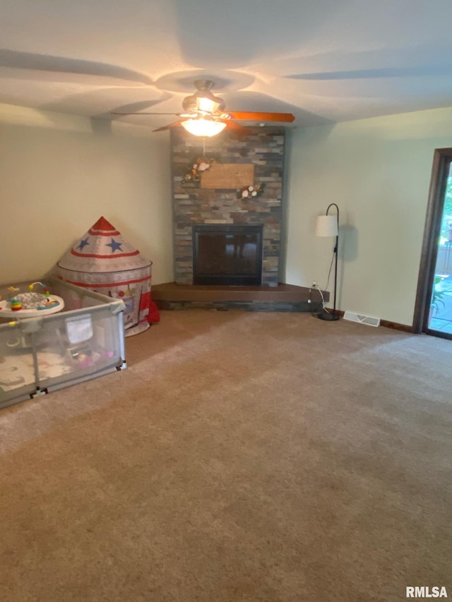 27 Apache Dr, Springfield, IL 62711 - carpeted living room featuring a ceiling fan and a fireplace