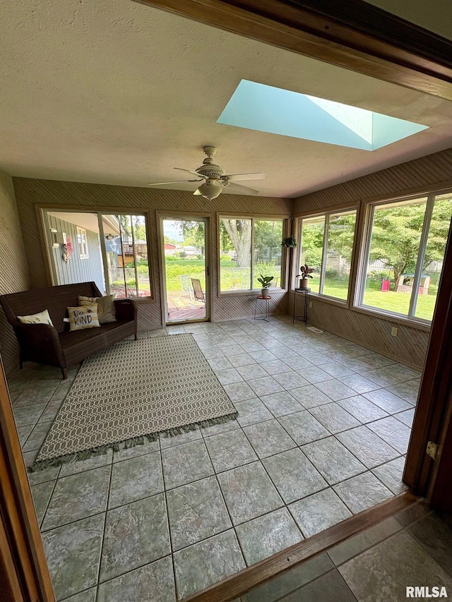 27 Apache Dr, Springfield, IL 62711 - sunroom / solarium featuring a skylight, ceiling fan, and tile patterned flooring