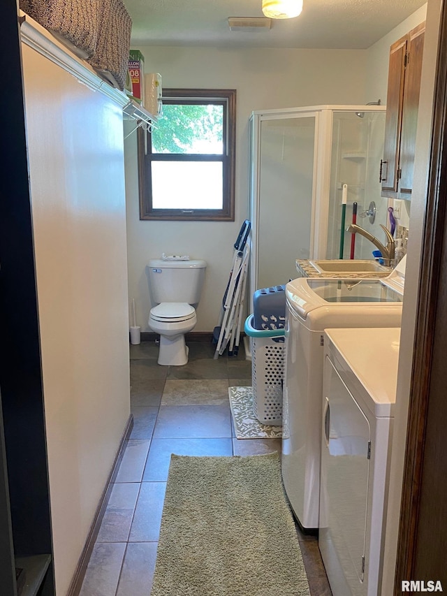 27 Apache Dr, Springfield, IL 62711 - full bath with washer and dryer, tile patterned floors, a stall shower, and vanity