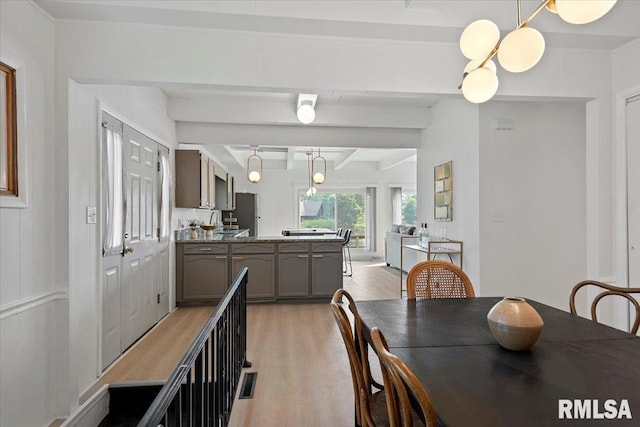 308 Elm Ln, Petersburg, IL 62675 - dining space featuring light wood-type flooring and beam ceiling