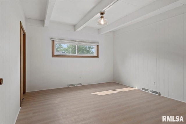 308 Elm Ln, Petersburg, IL 62675 - empty room with wood finished floors and beamed ceiling