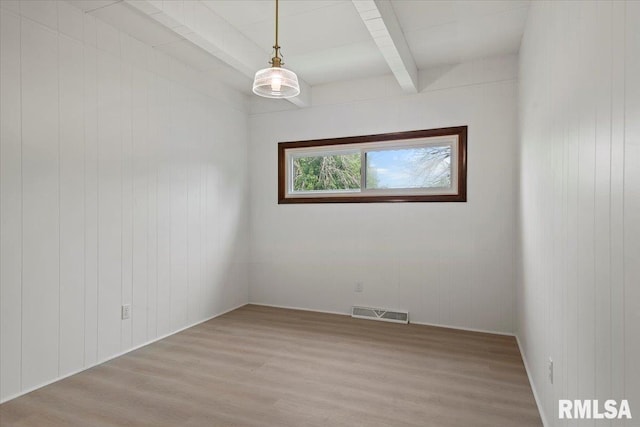 308 Elm Ln, Petersburg, IL 62675 - unfurnished room with beam ceiling and light wood-type flooring