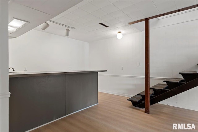 308 Elm Ln, Petersburg, IL 62675 - basement featuring wood finished floors, stairs, and track lighting