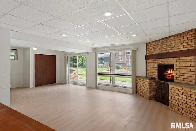 308 Elm Ln, Petersburg, IL 62675 - unfurnished living room with wood finished floors, a fireplace, a paneled ceiling, and recessed lighting
