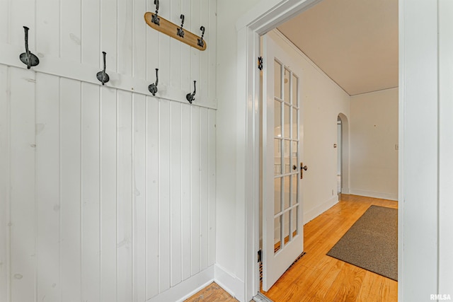 712 N Kickapoo St, Lincoln, IL 62656 - mudroom featuring light wood-type flooring and arched walkways