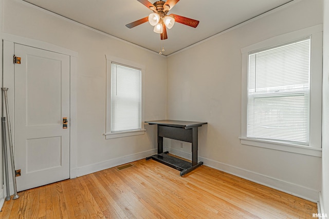 712 N Kickapoo St, Lincoln, IL 62656 - unfurnished room featuring light wood-style flooring and a ceiling fan