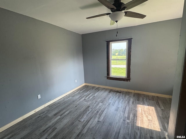 109 Kilgore St, West Point, IL 62380 - empty room with wood finished floors and a ceiling fan