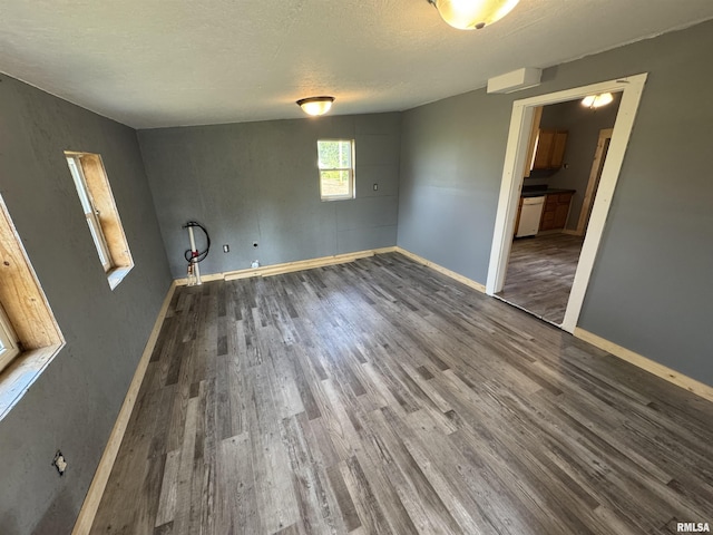 109 Kilgore St, West Point, IL 62380 - spare room featuring wood finished floors and a textured ceiling
