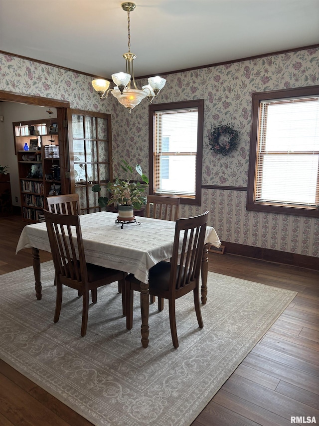 1905 S Whittier Ave, Springfield, IL 62704 - dining space with a chandelier, wallpapered walls, and wood finished floors
