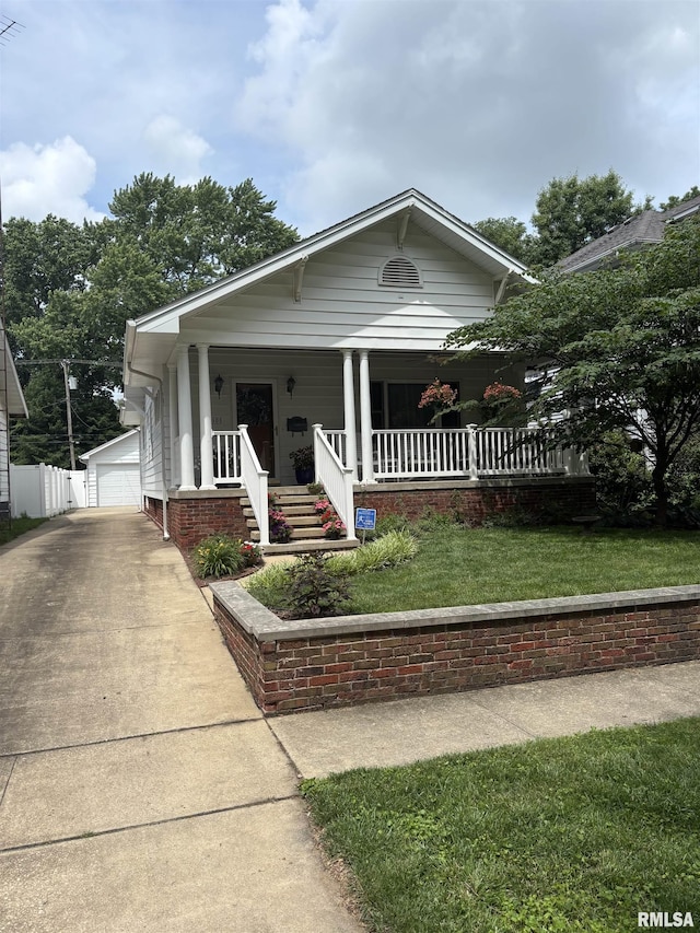 1905 S Whittier Ave, Springfield, IL 62704 - bungalow with a porch, an outbuilding, and a detached garage