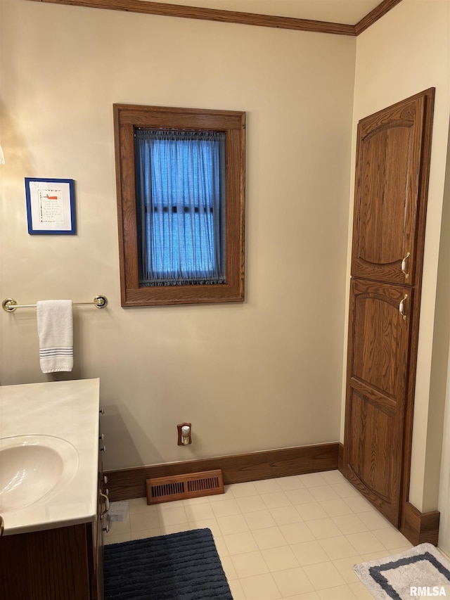 1905 S Whittier Ave, Springfield, IL 62704 - bathroom featuring ornamental molding and vanity