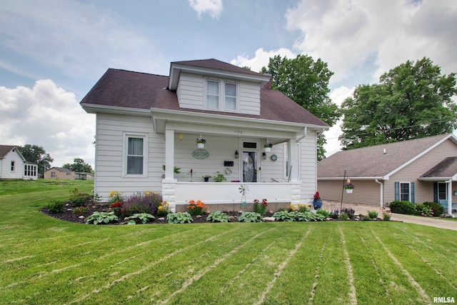 1728 Adams St, Quincy, IL 62301 - bungalow featuring a front lawn and covered porch