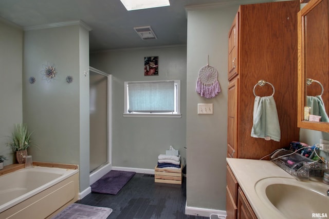 1728 Adams St, Quincy, IL 62301 - full bath featuring a stall shower, wood finished floors, a bath, crown molding, and vanity