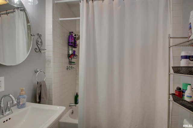 1728 Adams St, Quincy, IL 62301 - full bath featuring a sink and shower / bath combo with shower curtain