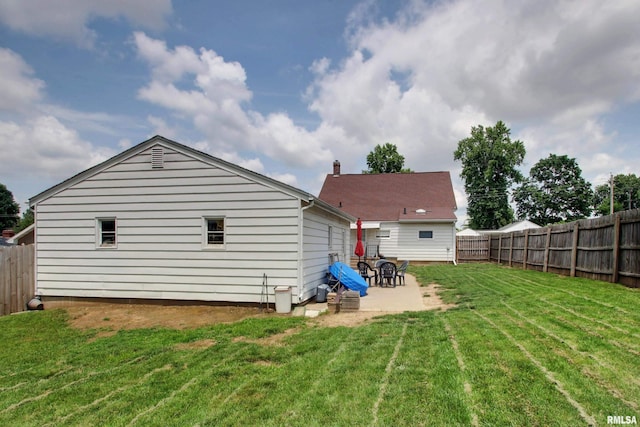 1728 Adams St, Quincy, IL 62301 - rear view of house featuring a patio area and a fenced backyard