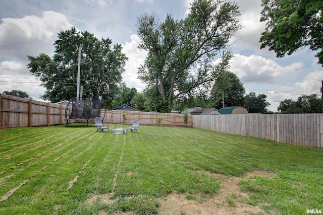 1728 Adams St, Quincy, IL 62301 - fenced backyard with a trampoline