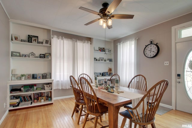 1728 Adams St, Quincy, IL 62301 - dining area with ceiling fan, wood-type flooring, and crown molding