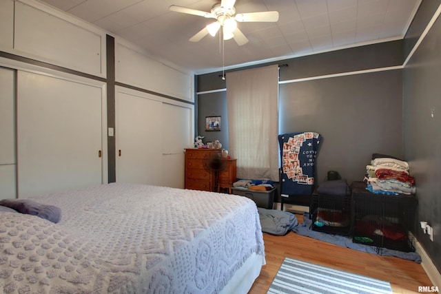 1728 Adams St, Quincy, IL 62301 - bedroom with light wood-type flooring and ceiling fan