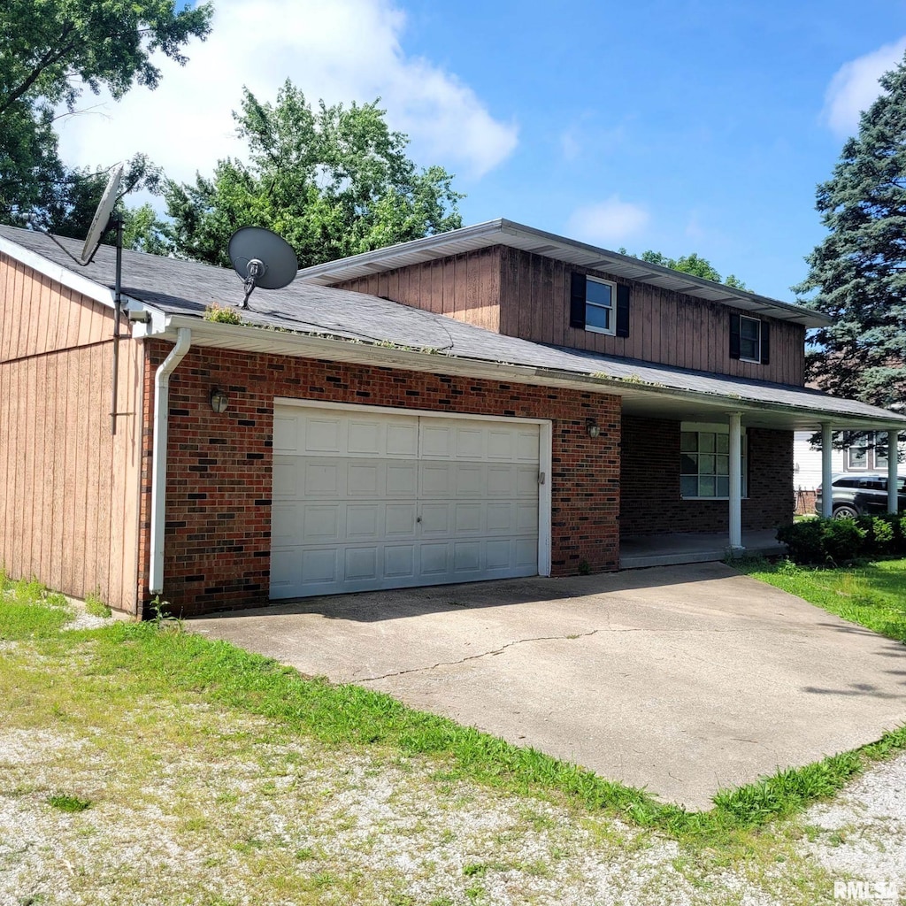 222 E Apple Orchard Rd, Springfield, IL 62703 - view of front of property with a garage, concrete driveway, and brick siding