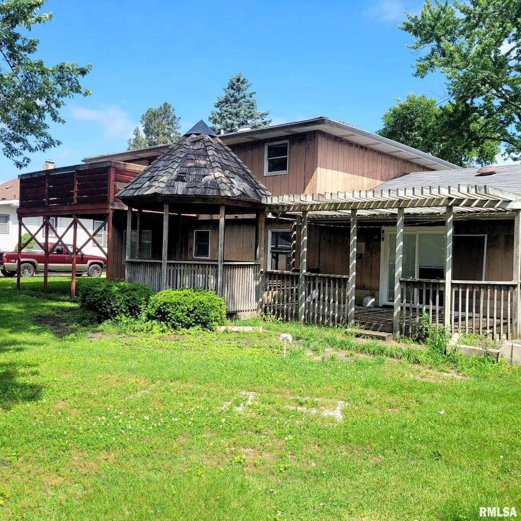 222 E Apple Orchard Rd, Springfield, IL 62703 - back of house featuring a lawn