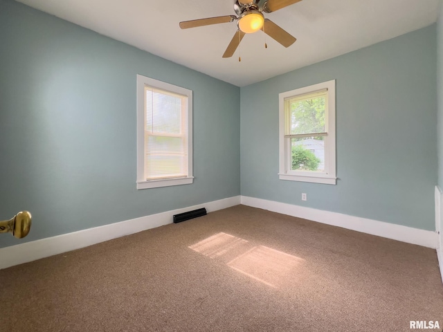100 N Austin Ave, Abingdon, IL 61410 - carpeted spare room featuring a ceiling fan and baseboards