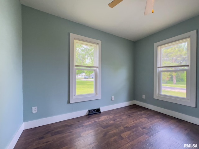 100 N Austin Ave, Abingdon, IL 61410 - spare room featuring dark wood-style flooring and a ceiling fan