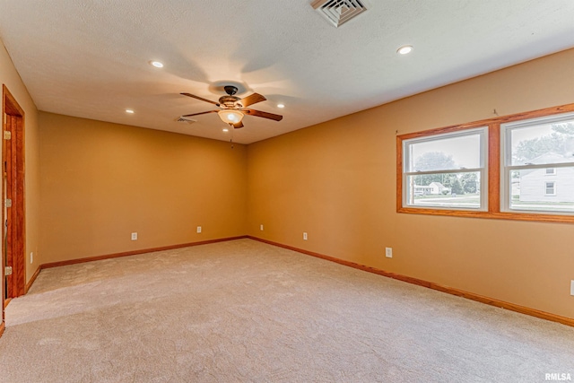 205 E Pine St, Broadwell, IL 62634 - unfurnished room featuring ceiling fan, light carpet, and recessed lighting