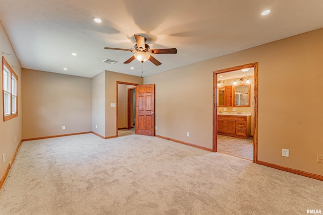 205 E Pine St, Broadwell, IL 62634 - unfurnished bedroom with recessed lighting, light colored carpet, connected bathroom, and ceiling fan