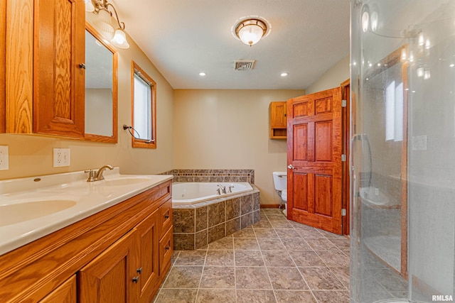 205 E Pine St, Broadwell, IL 62634 - bathroom featuring double vanity, a garden tub, a shower stall, and tile patterned floors