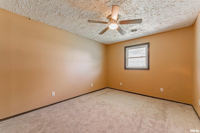 205 E Pine St, Broadwell, IL 62634 - carpeted empty room with a ceiling fan and a textured ceiling